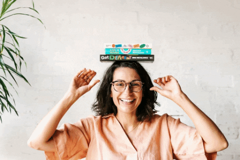 Nadine Nethery, copywriter for female entrepreneurs, blowing confetti