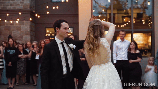 couple slow dancing and twirling