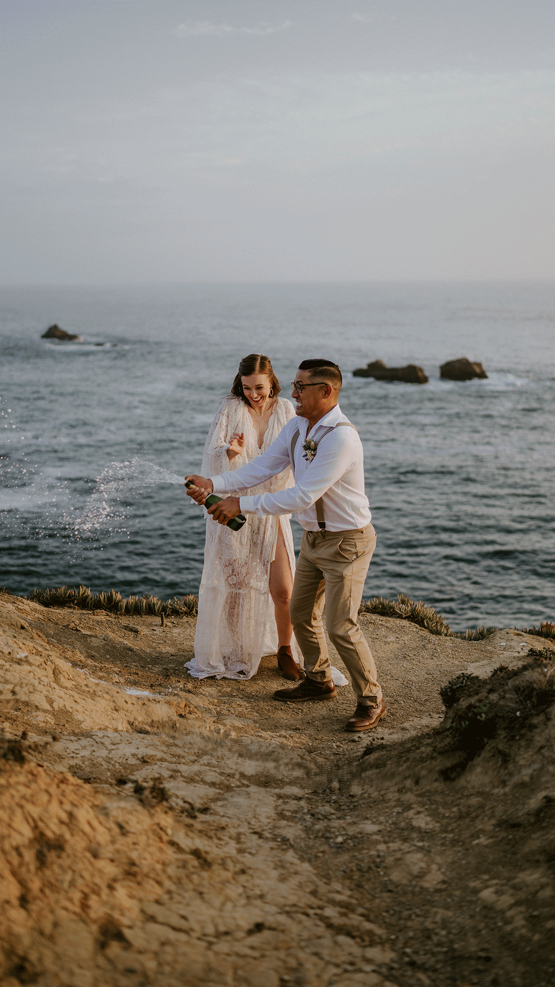 bride and groom popping champagne toast for their coastal CA elopement