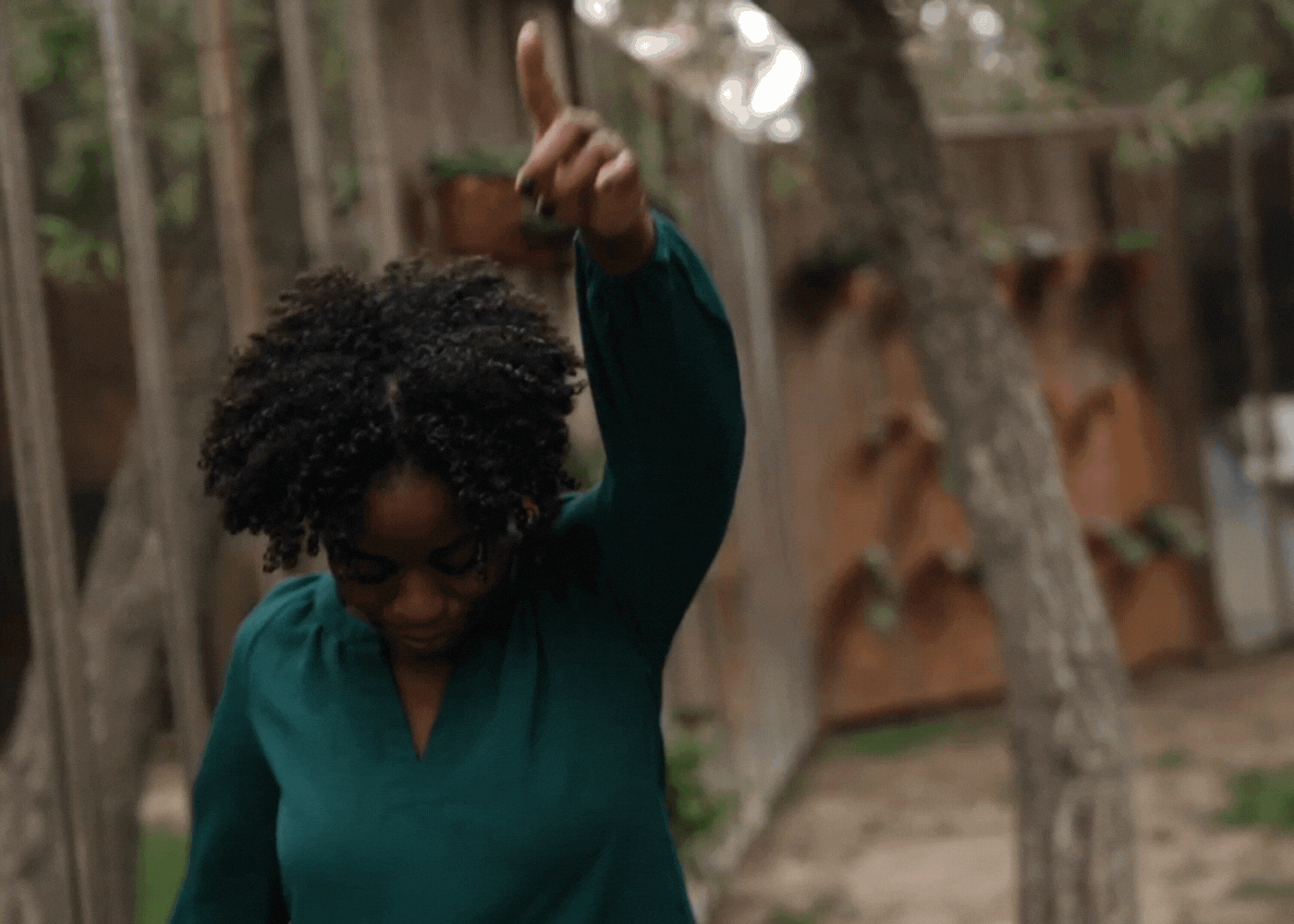 GIF of a woman dancing and laughing.