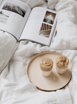 editorial book with coffee on the bed