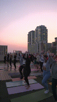 People dancing with their hands in the air