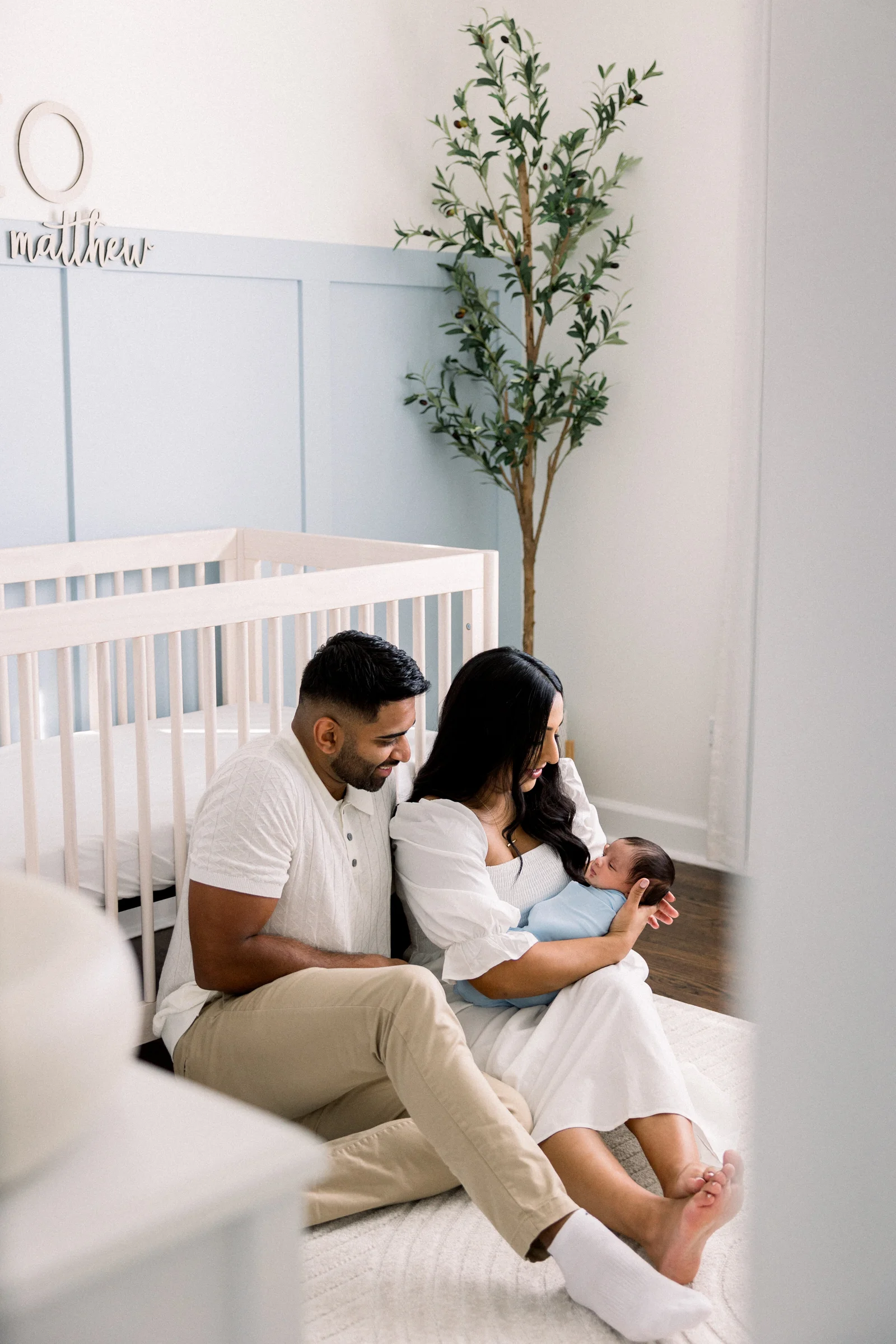 Chicago family with their newborn in the nursery, Captured by Sammi