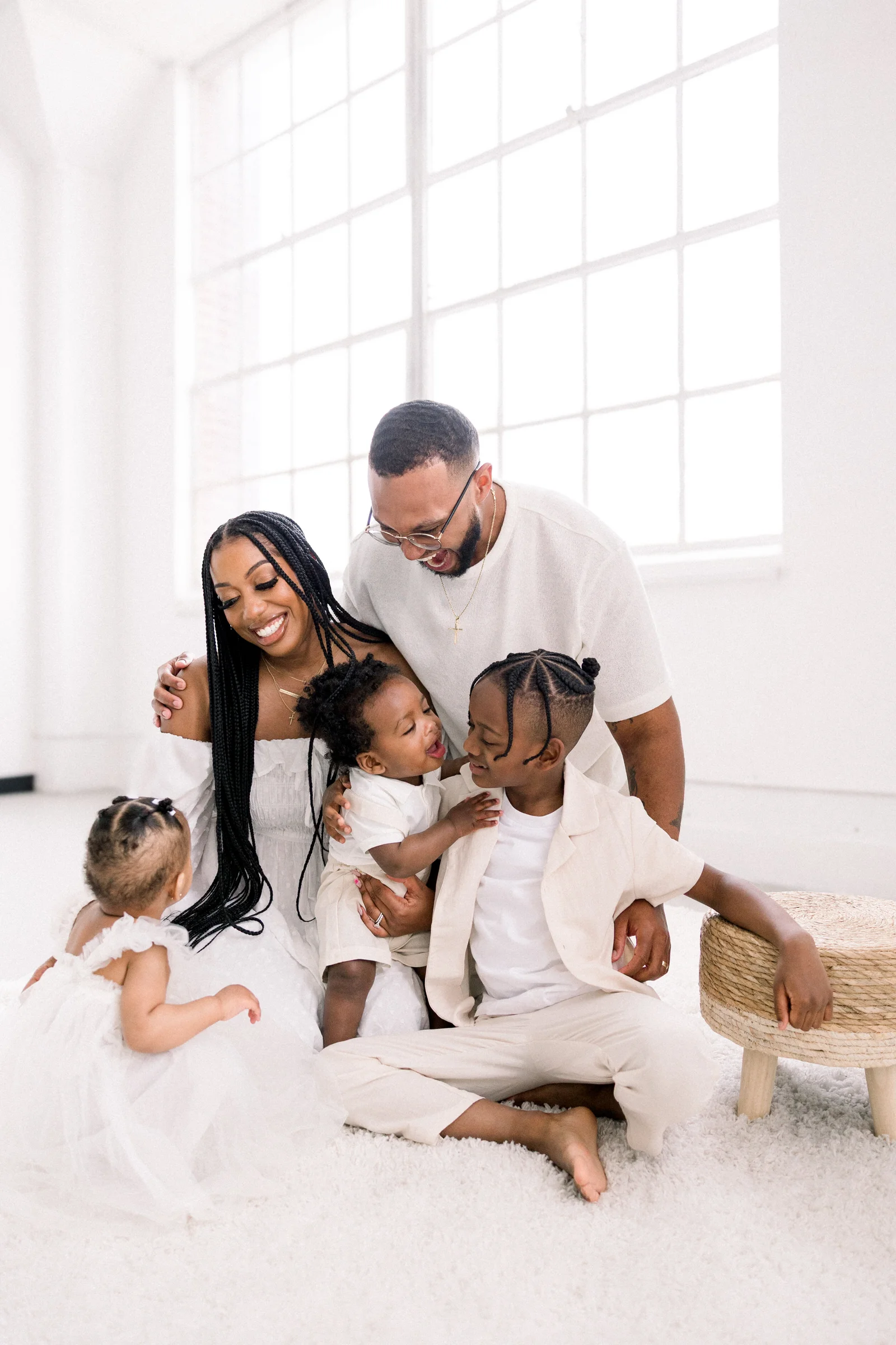 Family of five laughing in the Chicago studio