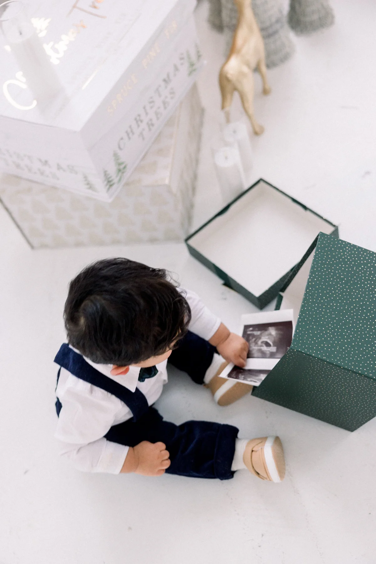 Child opening a holiday gift box